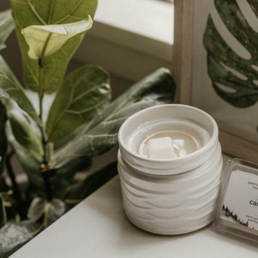 White electric wax warmer for soy wax melts with a hand made soy wax melt