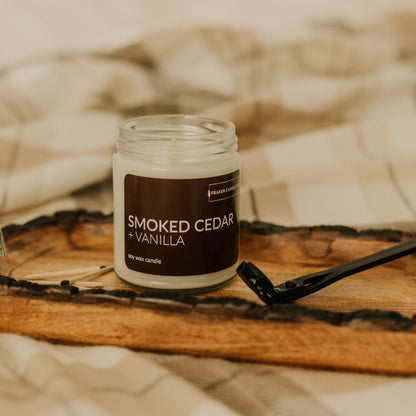 soy wax candle with smoked cedar and vanilla scent notes in a 9 oz glass jar
